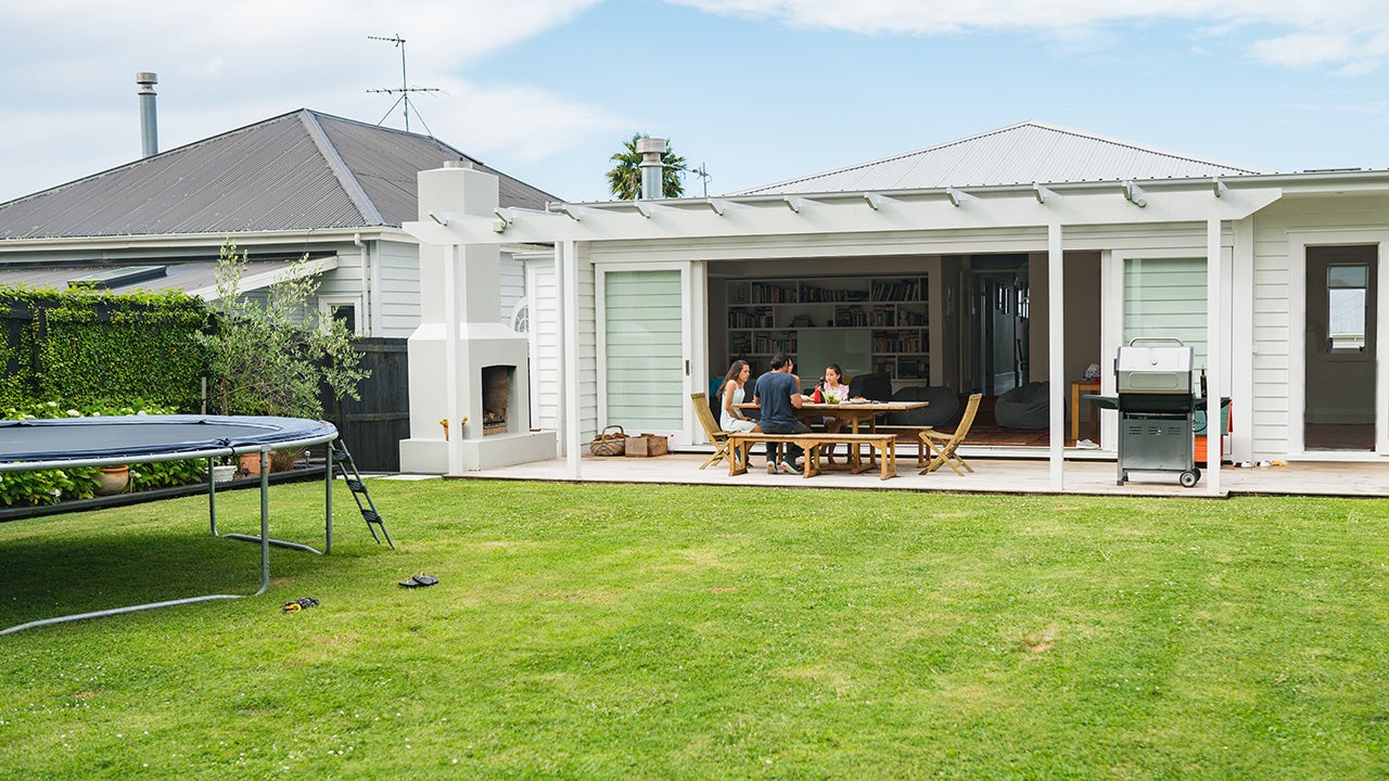 A young Mixed race family having lunch at home in Auckland, New Zealand.