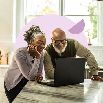 Senior couple looking at a laptop