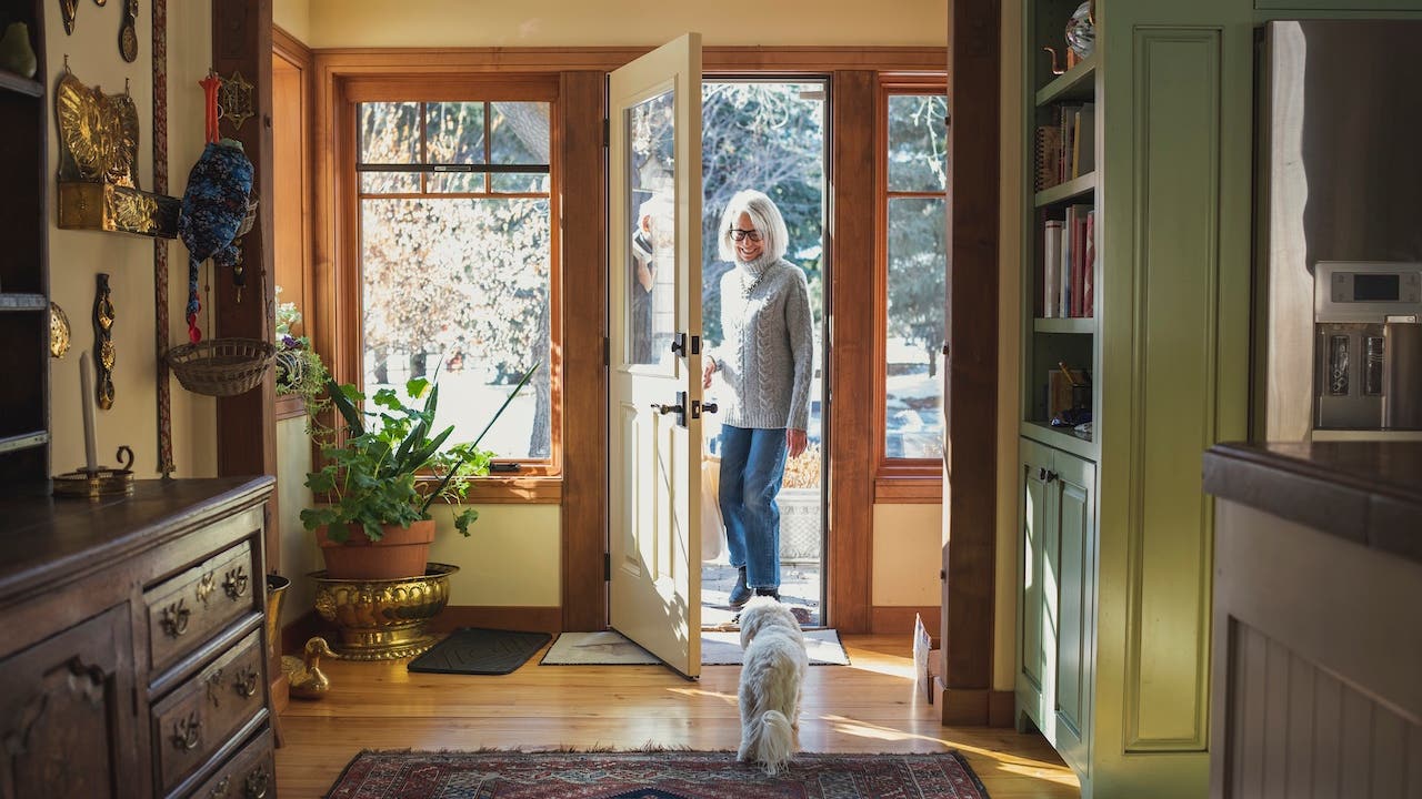 Man and woman arriving home