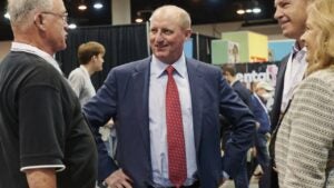 Greg Abel, chairman of Berkshire Hathaway Energy, center, during a shareholders shopping day ahead of the Berkshire Hathaway annual meeting in Omaha, Nebraska, U.S., on Friday, April 29, 2022.